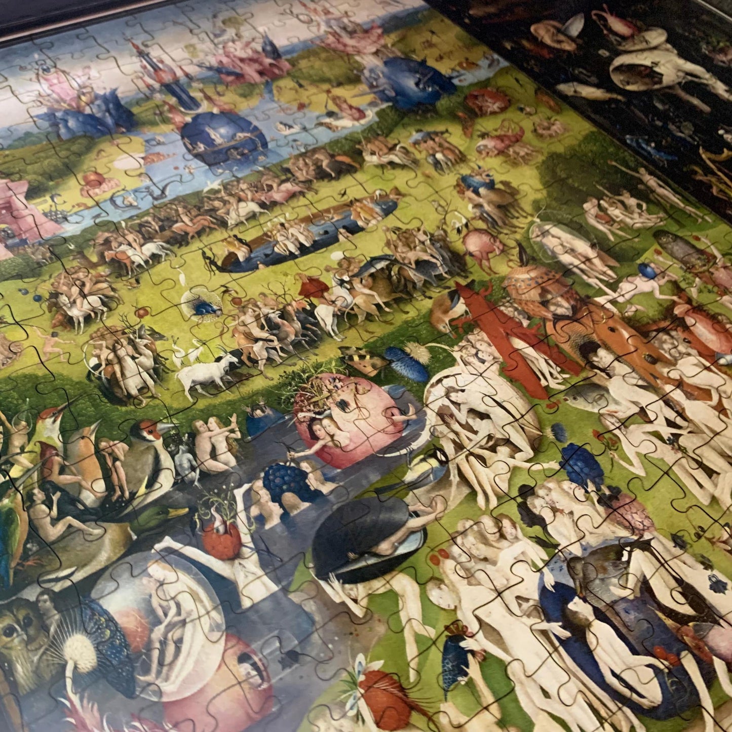 Hieronymus Bosch’s ‘The Garden of Earthly Delights’ wooden jigsaw puzzle, featuring a surreal medieval triptych with paradise, earth, and hell.