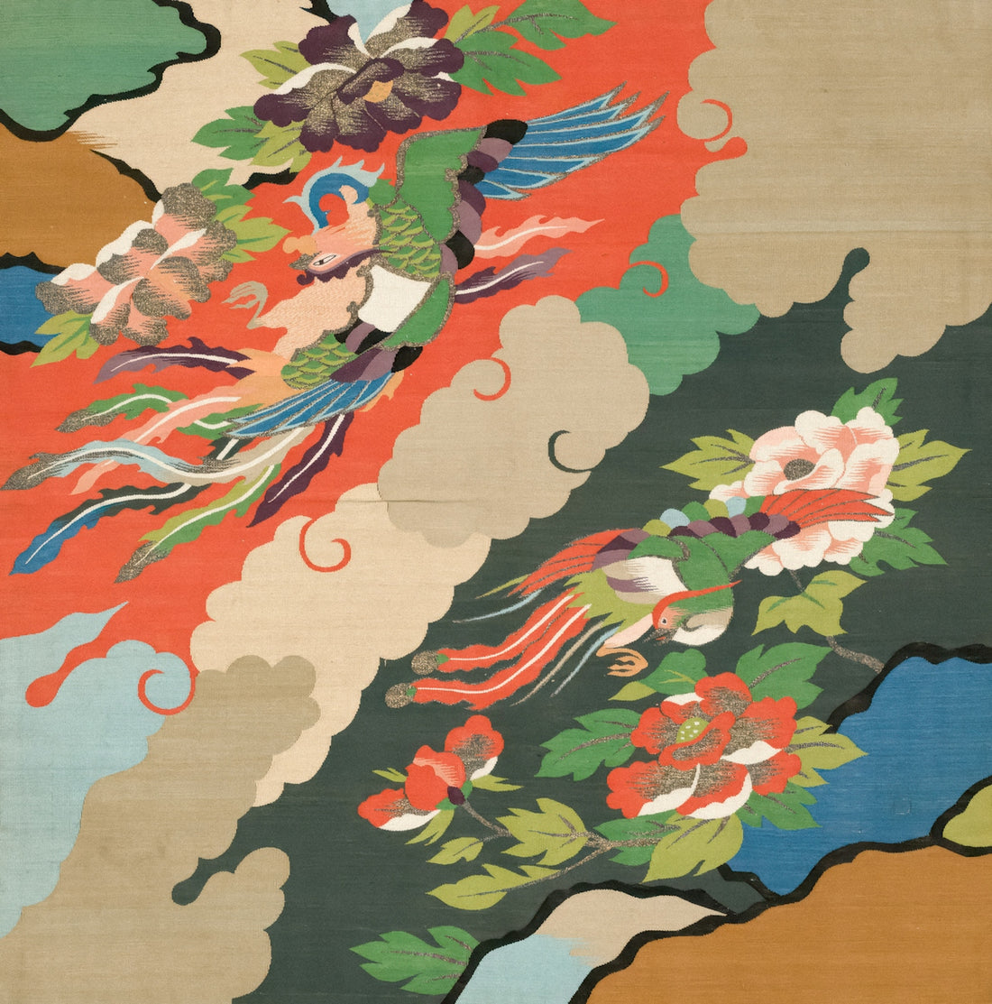 a large oriental rug with flowers and birds on it