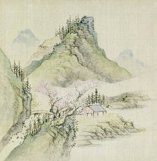 Misty mountains with a small house and blooming tree