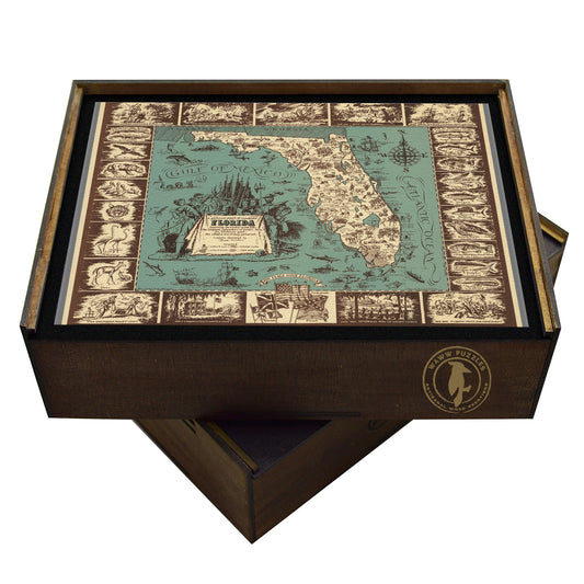 A high-quality wooden jigsaw puzzle of a vintage pictorial map of Florida, featuring historical landmarks, native wildlife, and early explorations of the state. Comes in a handmade wooden keepsake box.