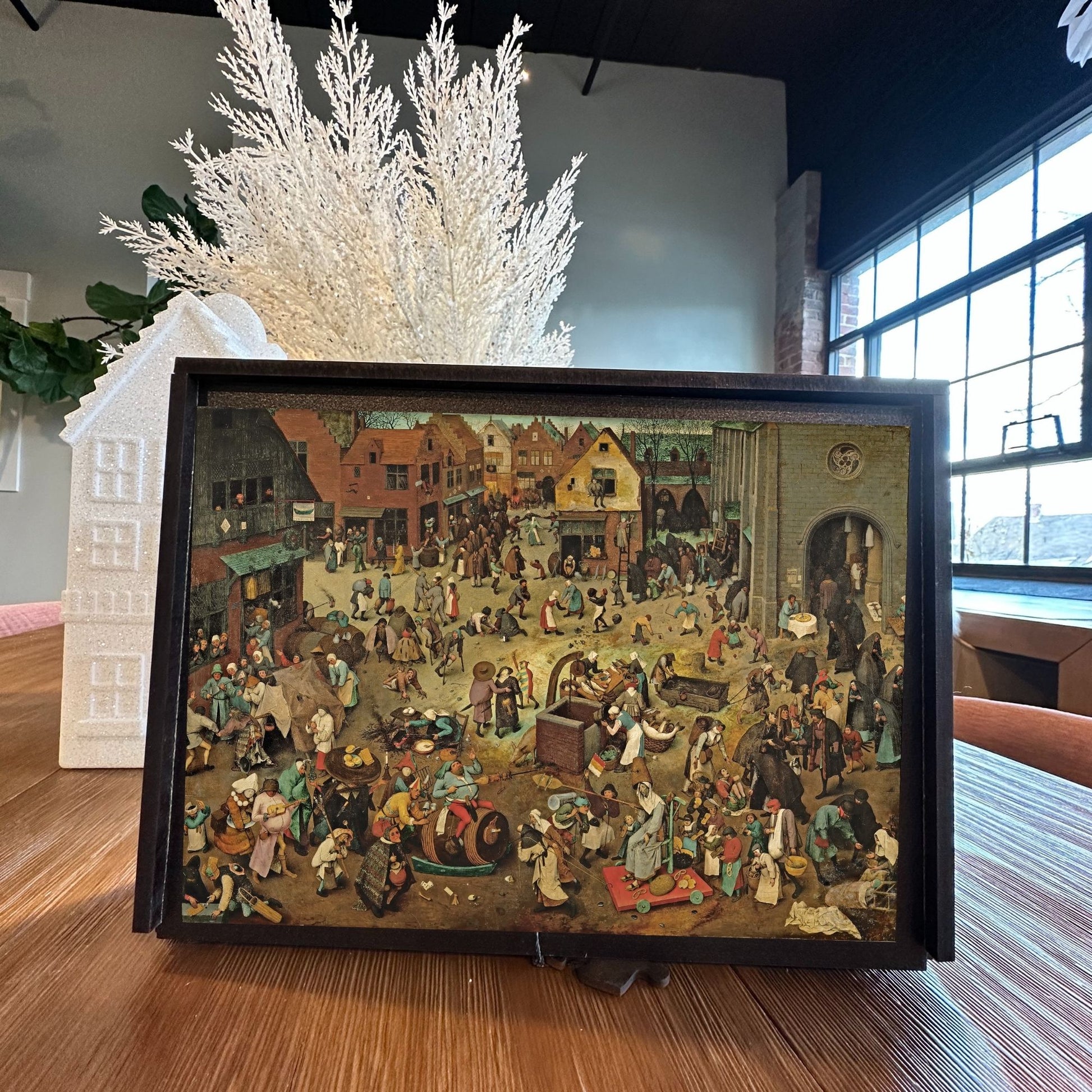 Wooden jigsaw puzzle of Bruegel's 'Fight Between Carnival and Lent' (1559) - allegorical Renaissance masterpiece of medieval life