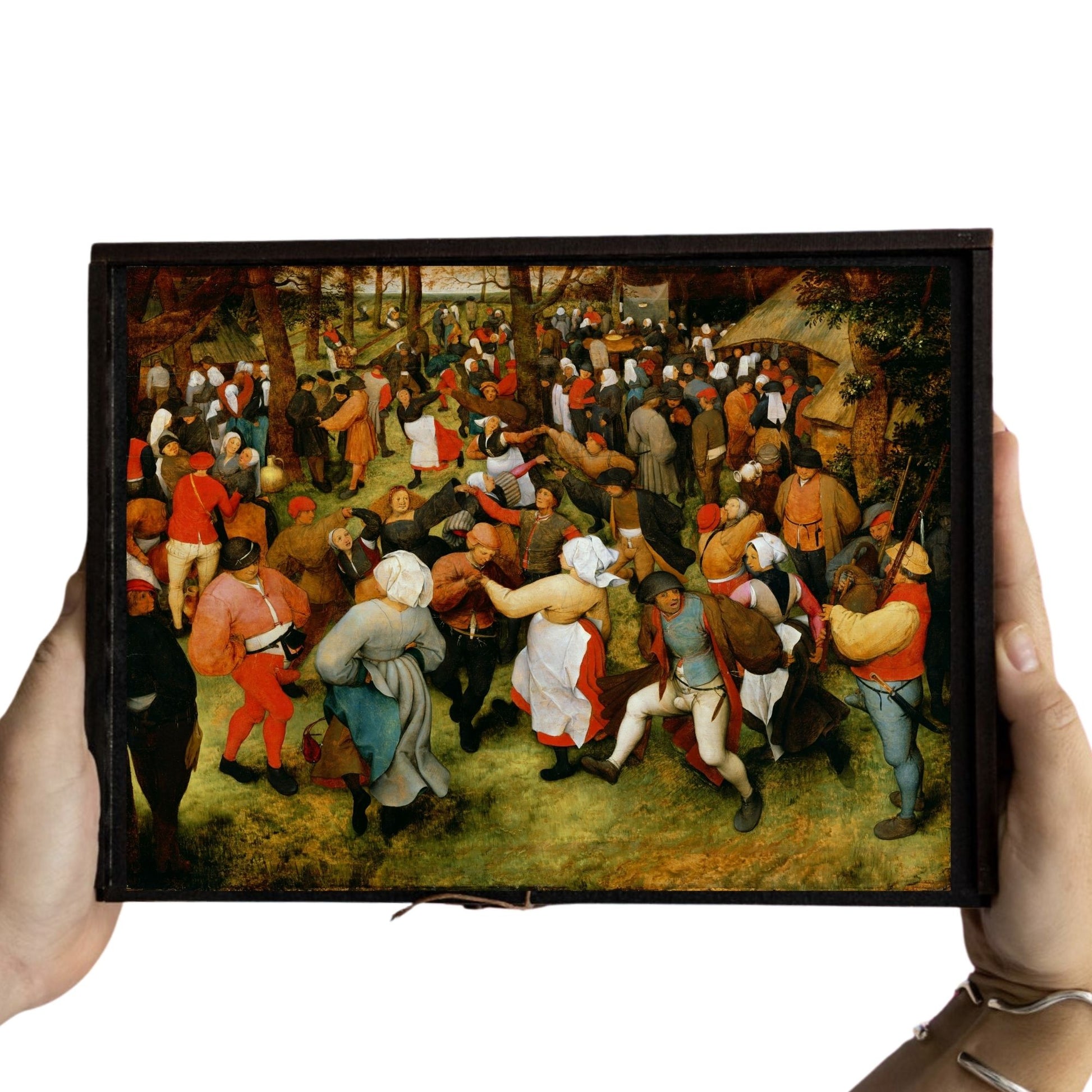 Bruegel’s ‘The Wedding Dance’ wooden jigsaw puzzle showing a lively 16th-century Flemish peasant celebration with vivid folk detail.