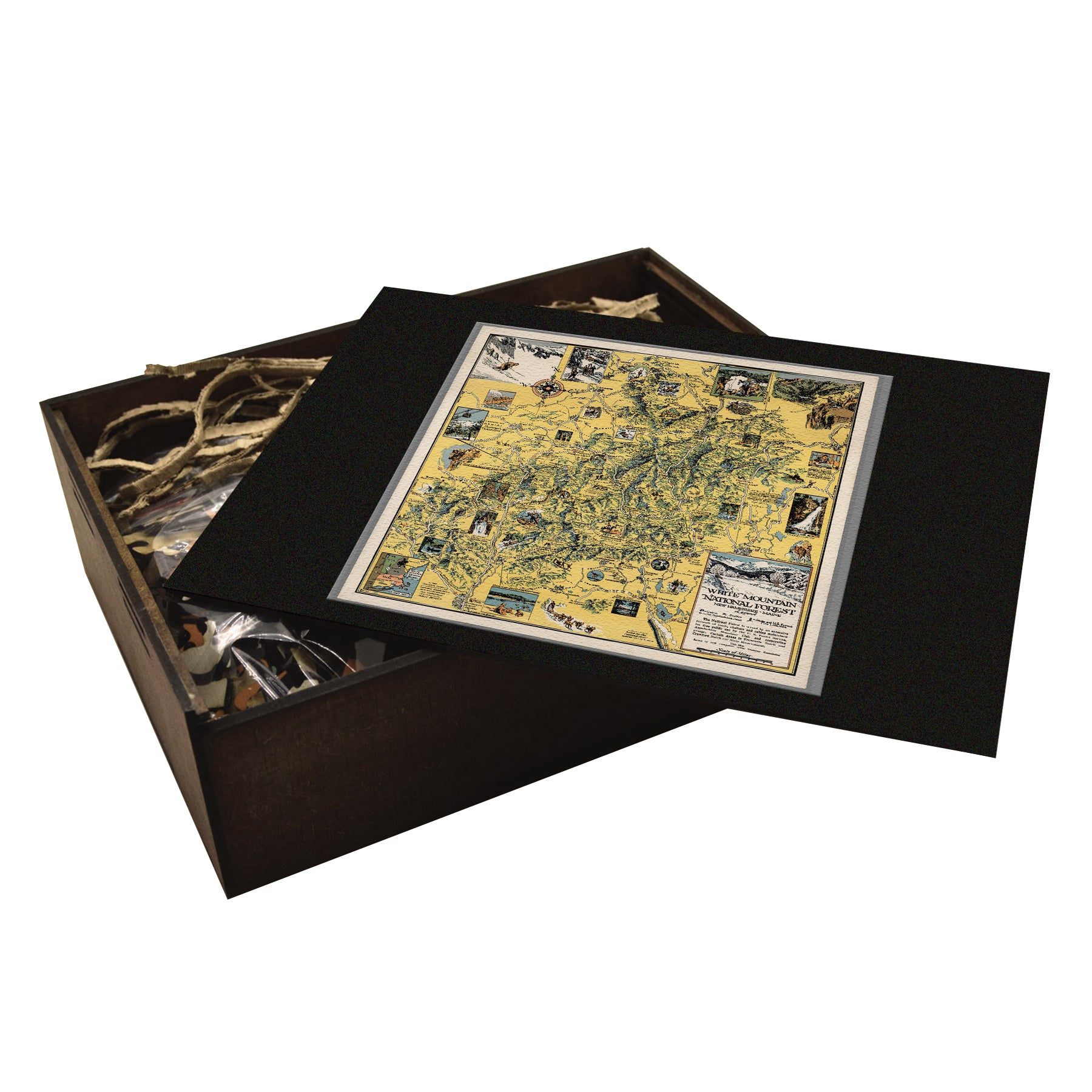 A high-quality wooden jigsaw puzzle of a vintage pictorial map of White Mountain National Forest, featuring hand-drawn landmarks, trails, and historical sites. Comes in a handmade wooden keepsake box.