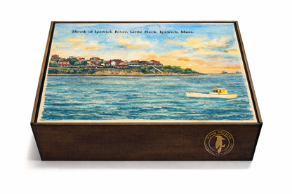 Handcrafted wooden puzzle featuring vintage watercolor of Little Neck and Ipswich River, Massachusetts, with a fishing boat and sunset sky. Eco-friendly jigsaw in artisan keepsake box from WAWW Puzzles.
