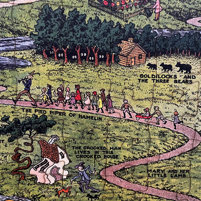 Close-up of partially completed The Land of Make Believe puzzle, with laser-cut wooden pieces mid-assembly.