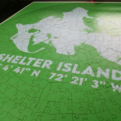 Jigsaw puzzle of Shelter Island with latitude and longitude coordinates on a green background