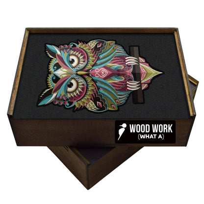 Handcrafted wooden box containing a colorful owl puzzle with intricate patterns. Unique and artistic gift.