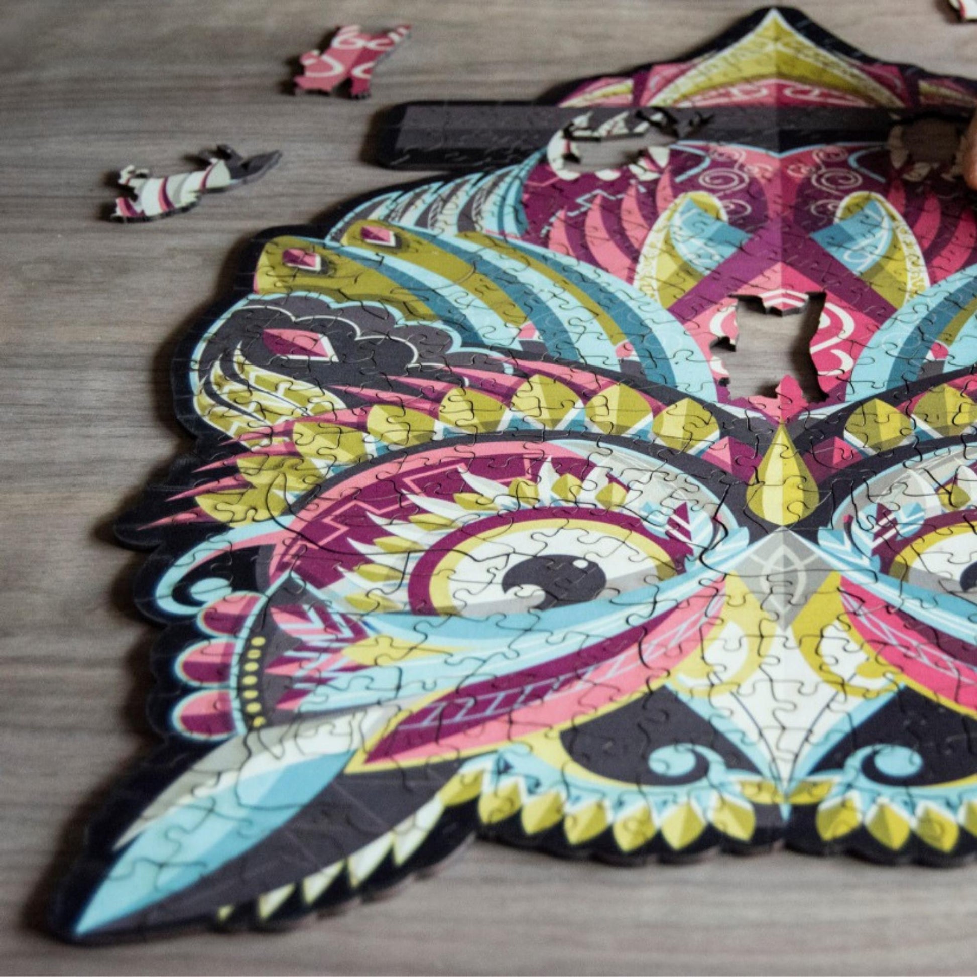 Colorful owl Wooden Jigsaw Puzzle: Stylized owl with a vibrant, patterned body. Intricate wooden puzzle