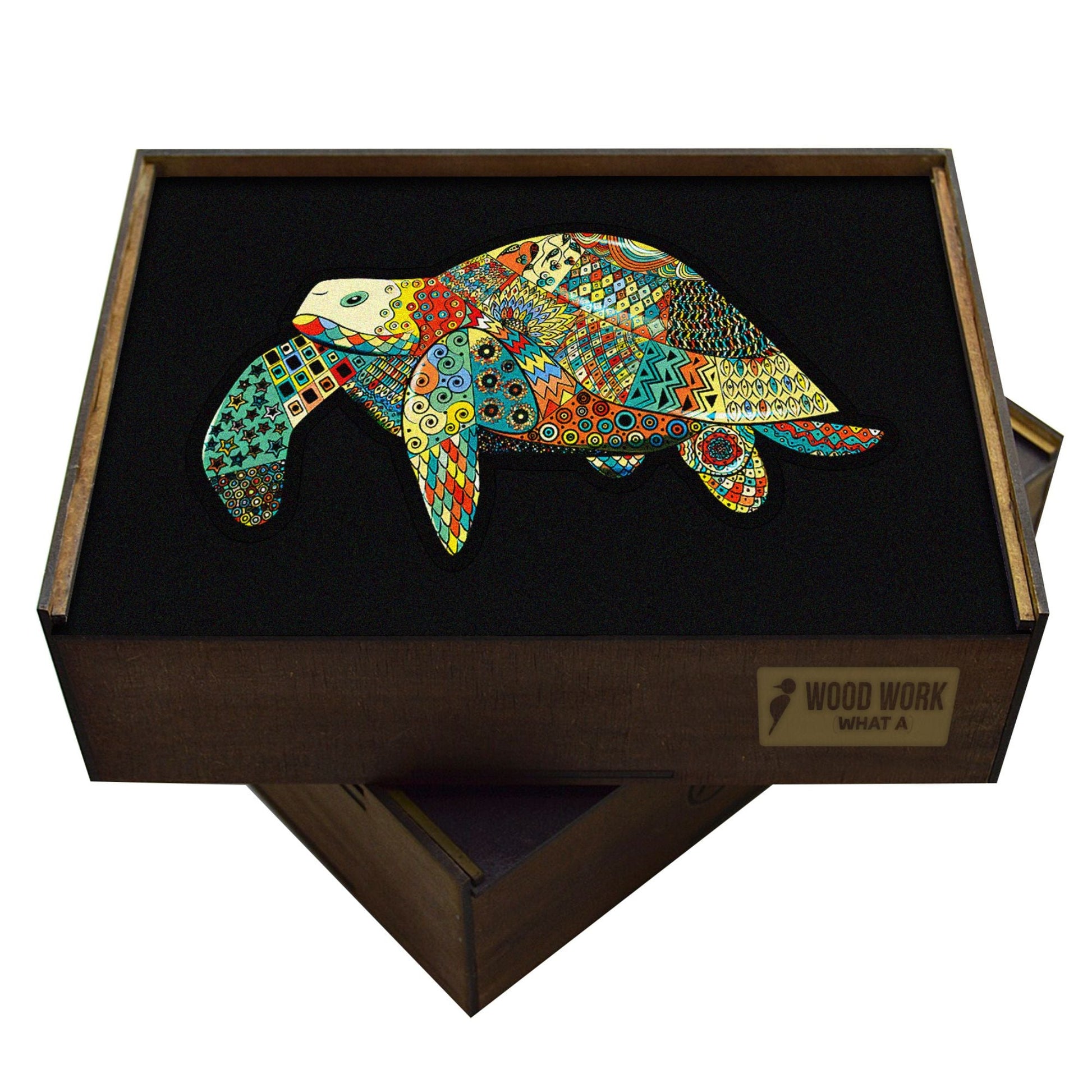 wooden handcrafted box containing a puzzle of a turtle