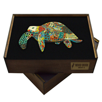 wooden handcrafted box containing a puzzle of a turtle