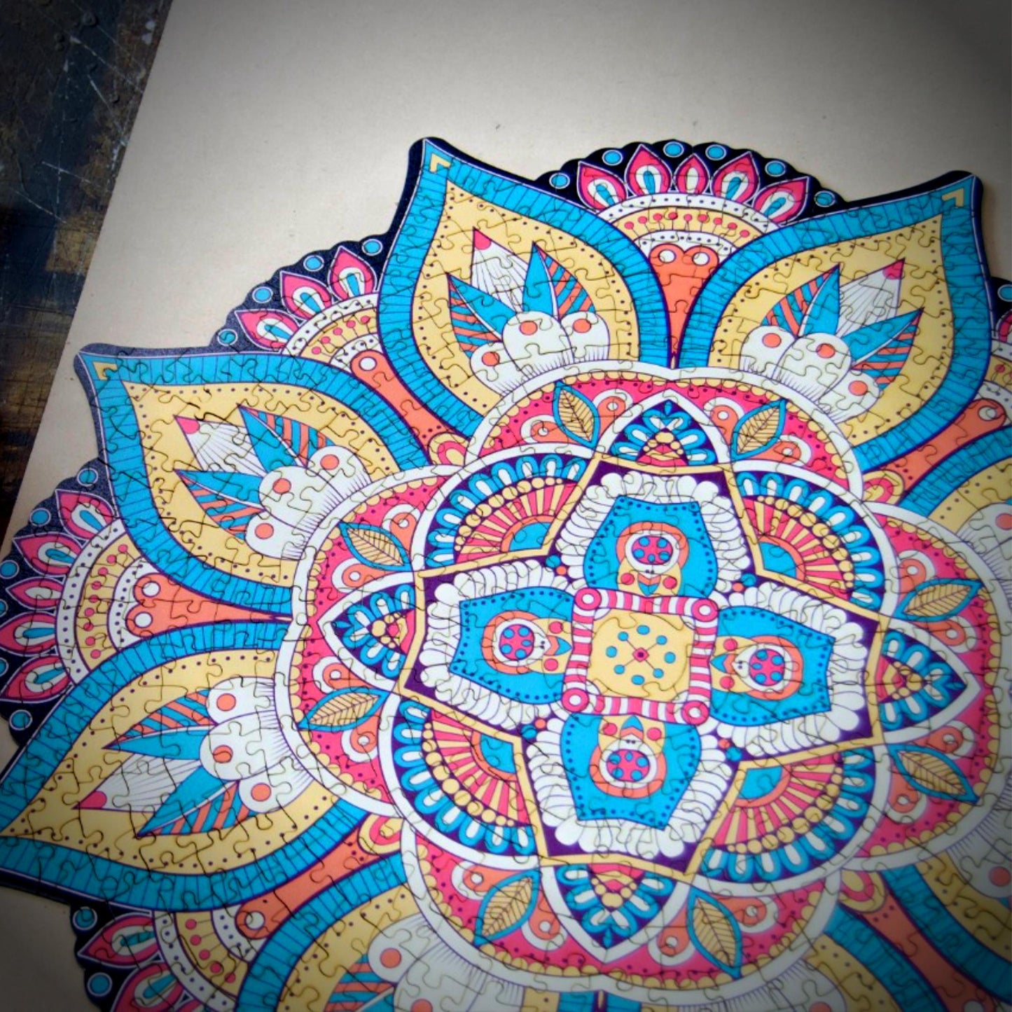 colorful mandala wooden jigsaw puzzle with a geometrical design.
