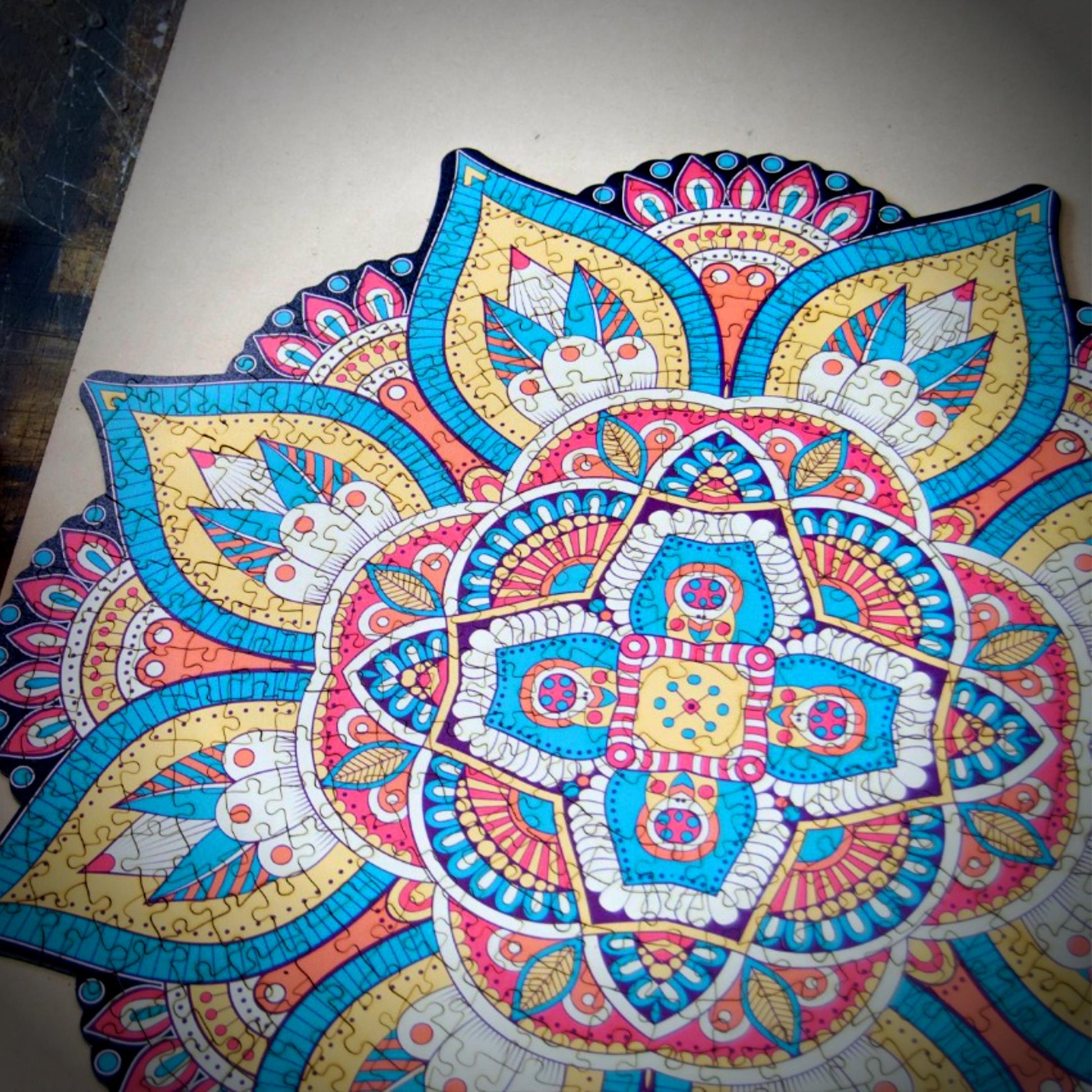 colorful mandala wooden jigsaw puzzle with a geometrical design.
