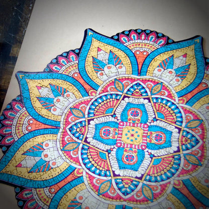 colorful mandala wooden jigsaw puzzle with a geometrical design.
