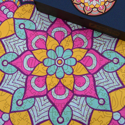 Handcrafted wooden box containing a colorful mandala puzzle with intricate patterns. Unique and artistic gift. WAWW Puzzles