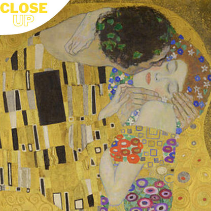 A high-quality wooden jigsaw puzzle of Gustav Klimt’s "The Kiss," featuring a golden embrace of two lovers wrapped in intricate Art Nouveau patterns and floral embellishments. Comes in a handmade wooden keepsake box.